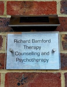 Outdoor sign displaying "Richard Bamford Therapy, Counselling and Psychotherapy"